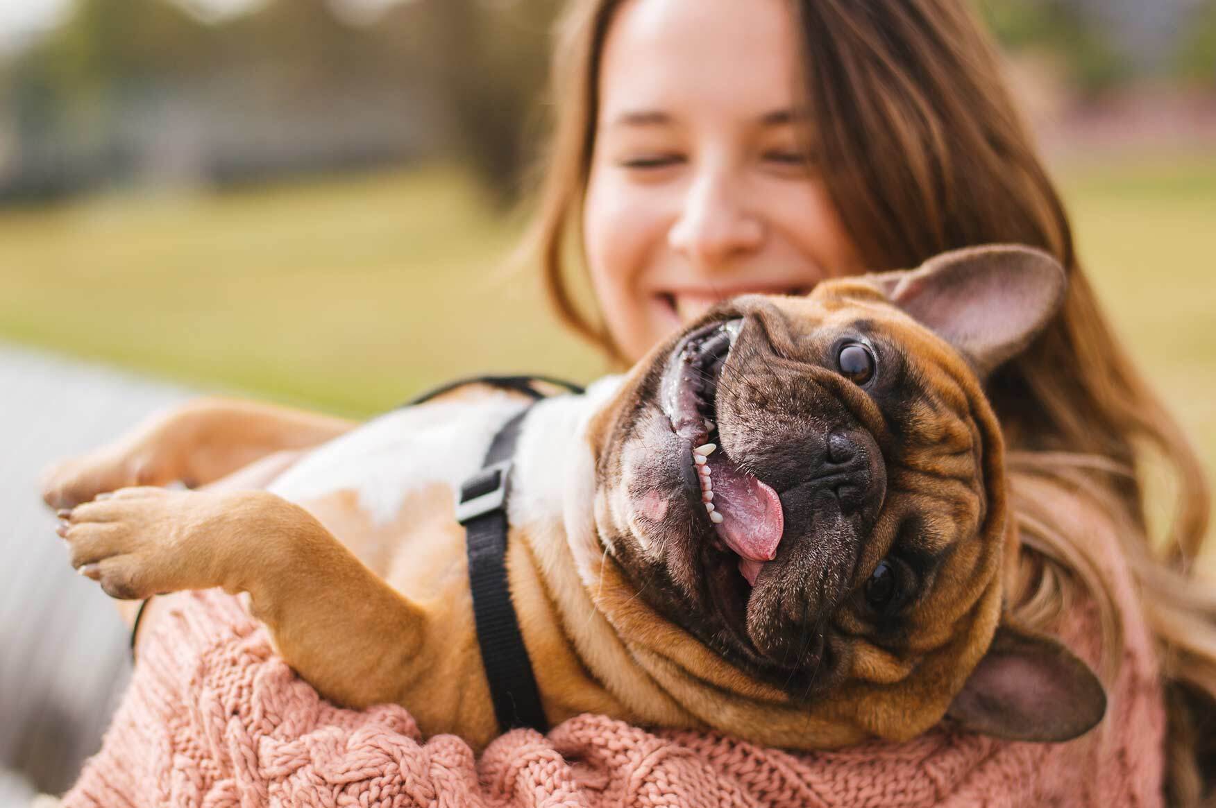 Woman holding a dog