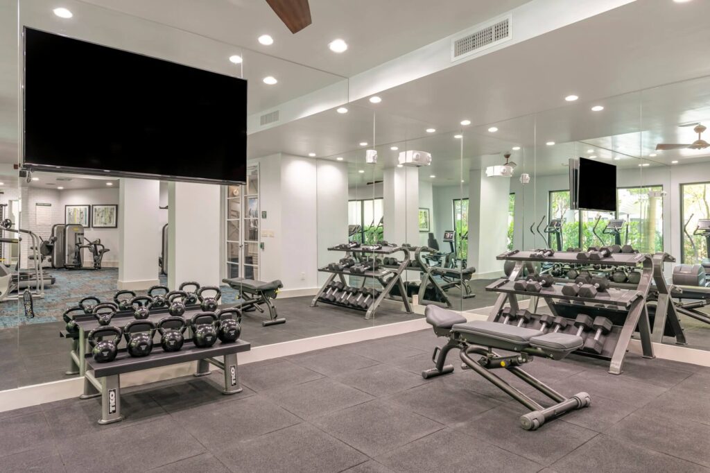 Fitness center with dumbbells and kettlebells