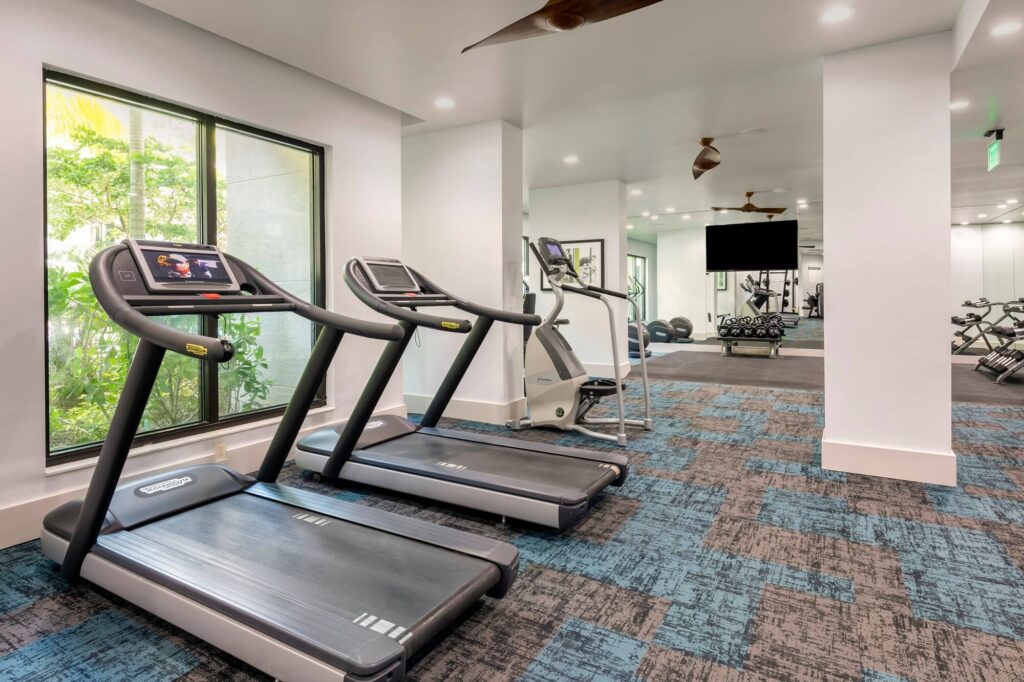 Fitness center with treadmills and TV